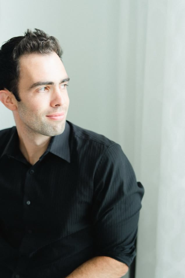 Nick Giulioni seated and looking out a window.